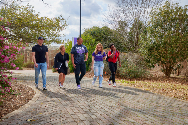 Students walk across MGA's Macon Campus.